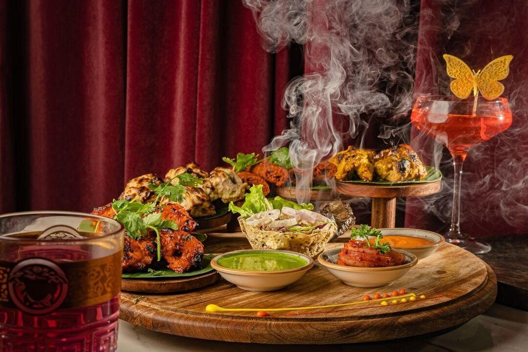 Platter of tandoori dishes and chutneys